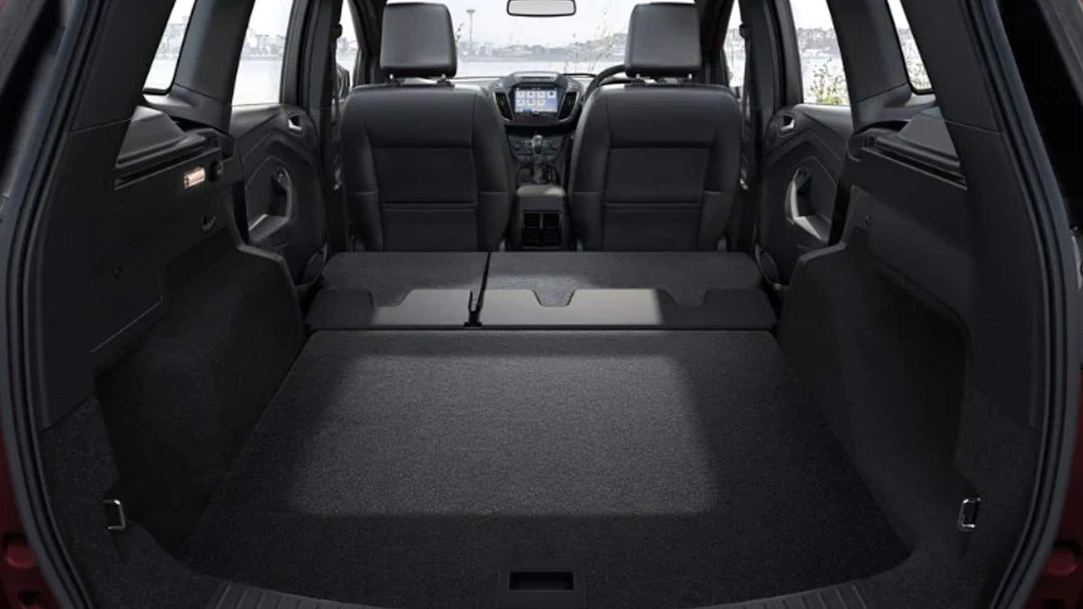 The empty trunk space of a Ford vehicle.