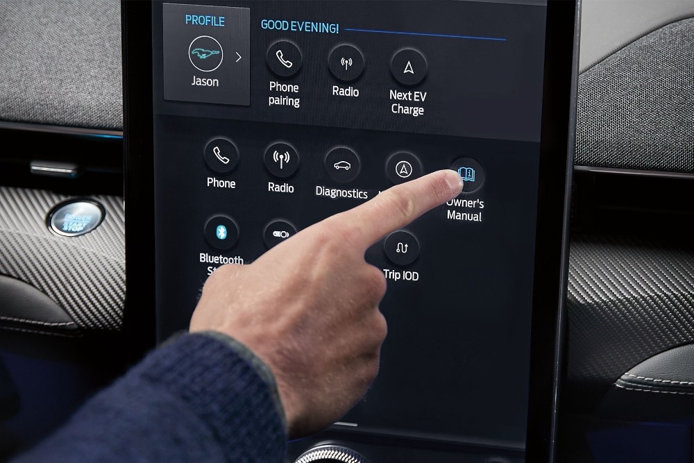 Person using manual control on the ford central display console