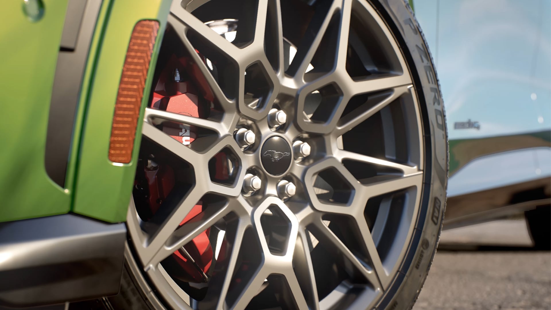 Lähikuva Ford Mustang Mach-E:n 20-tuumaisista Cast Aluminium Carbonised Grey -kevytmetallivanteista.