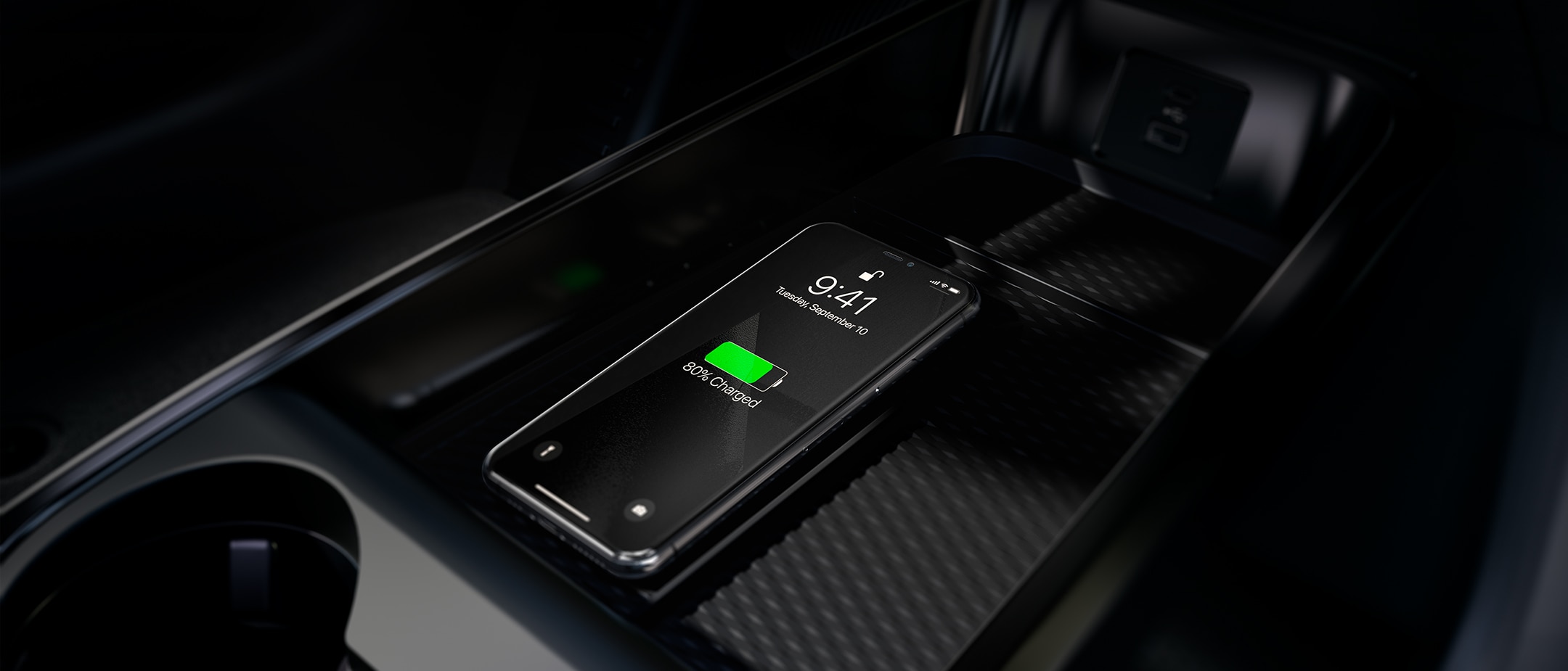 A smartphone charging in a Ford vehicle