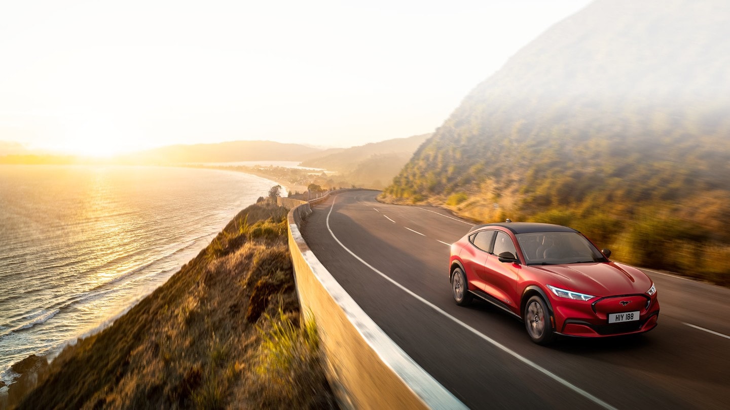 Ford Mustang Mach-E driving on coastal road