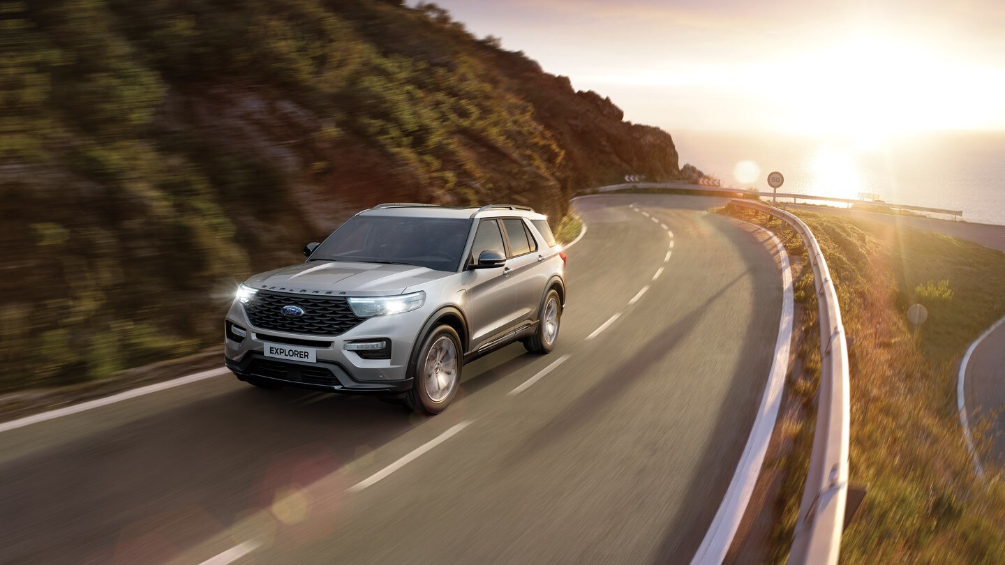 Ford Explorer driving on mountain road