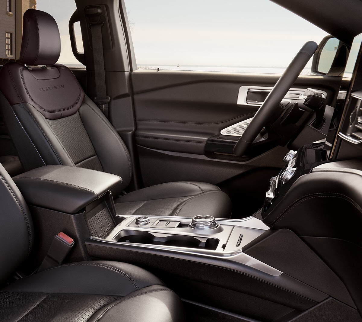 Ford Mondeo interior close up of hands with steering wheel and dashboard