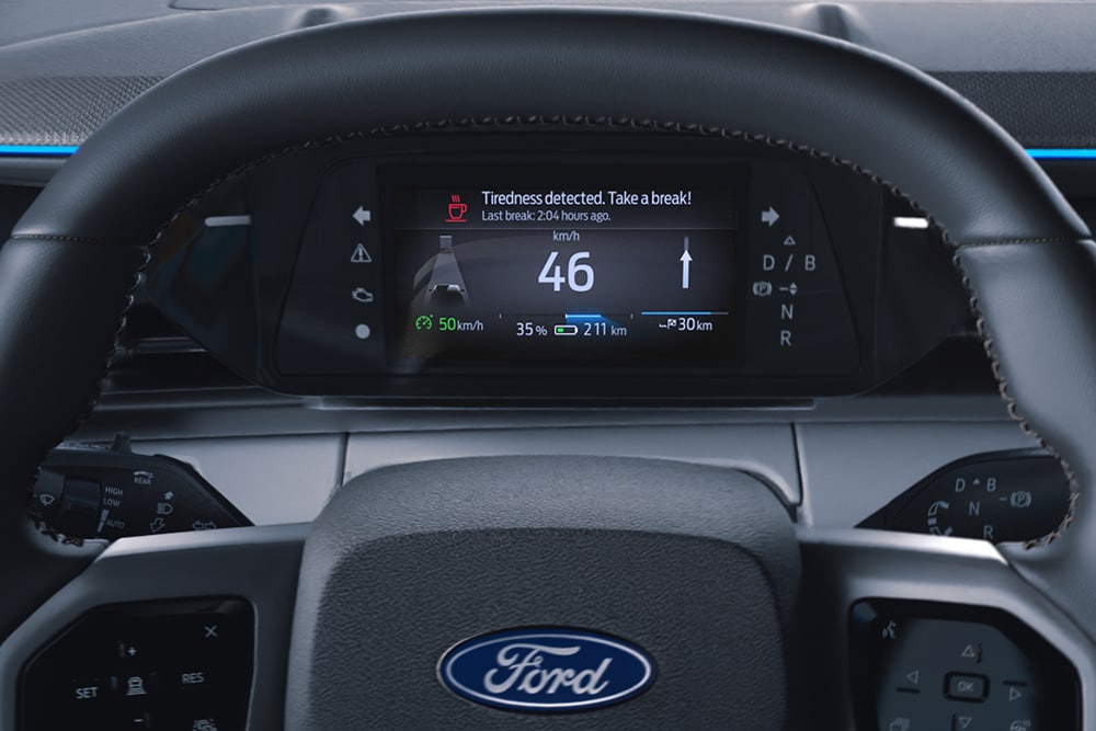 Lähikuva Ford Caprin® kuljettajan taukokehotuksesta, joka kertoo, kun on tauon aika.