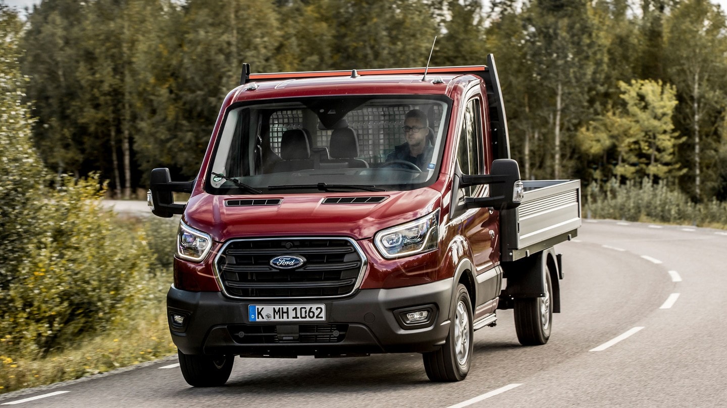 Transit Chassis Cab driving around bend in forest