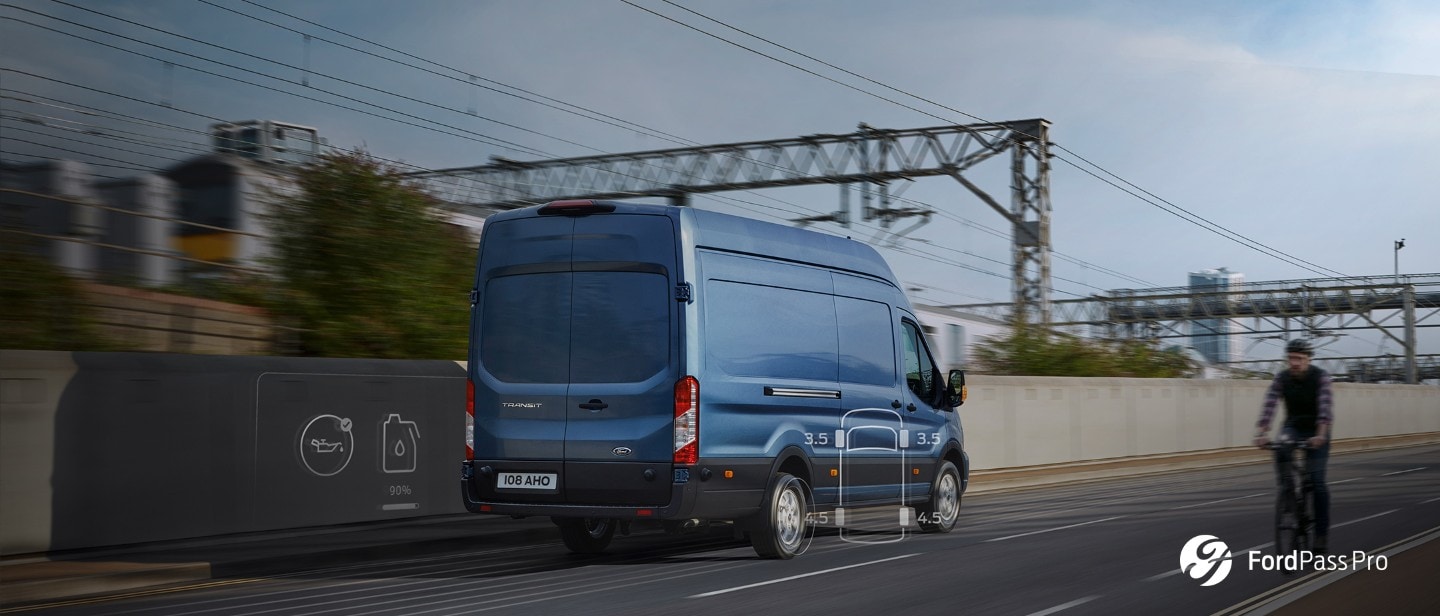 Blue Ford Transit Van rear three quarter view in motion