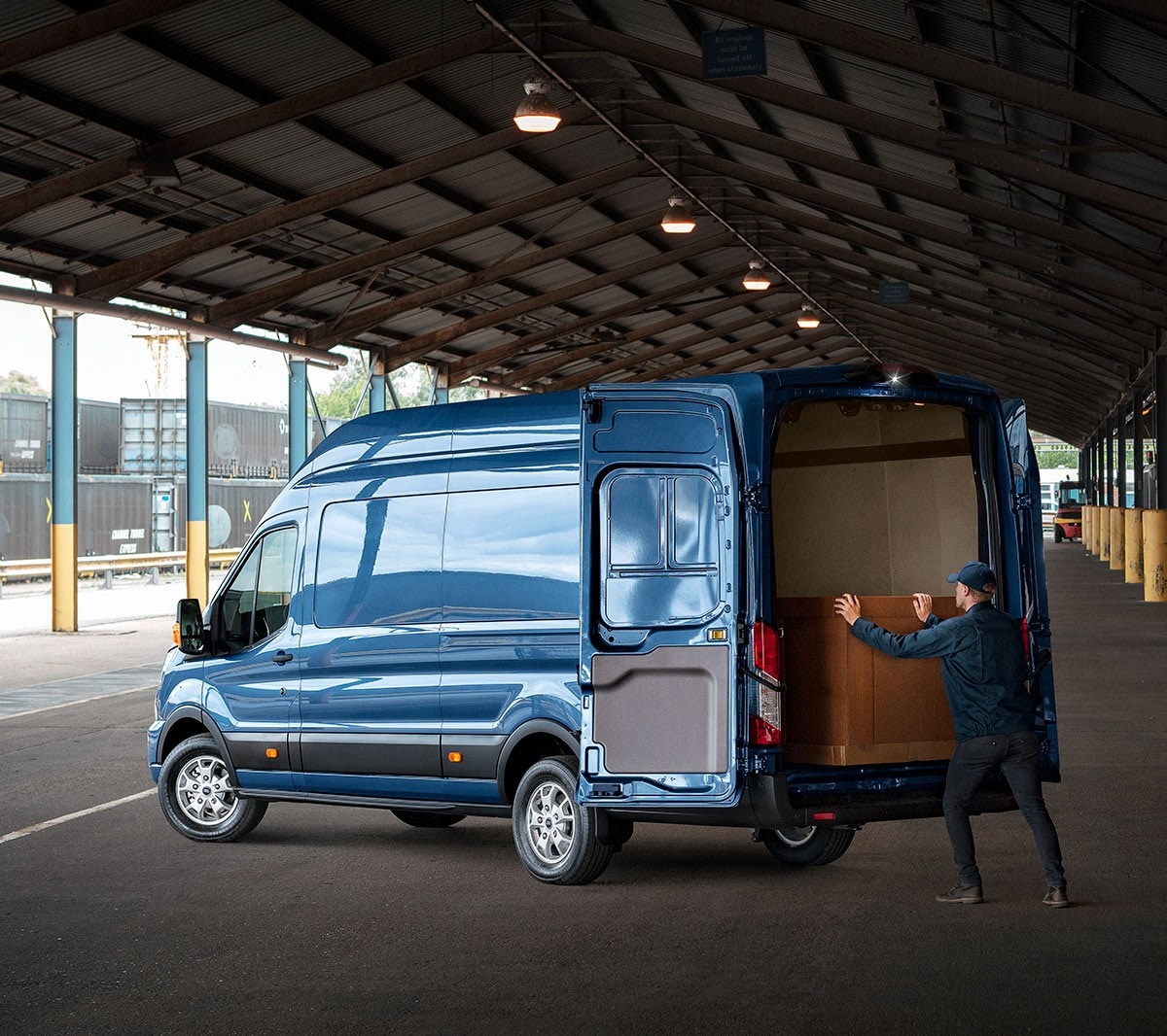 Ford Transit Van with person loading box into cargo space