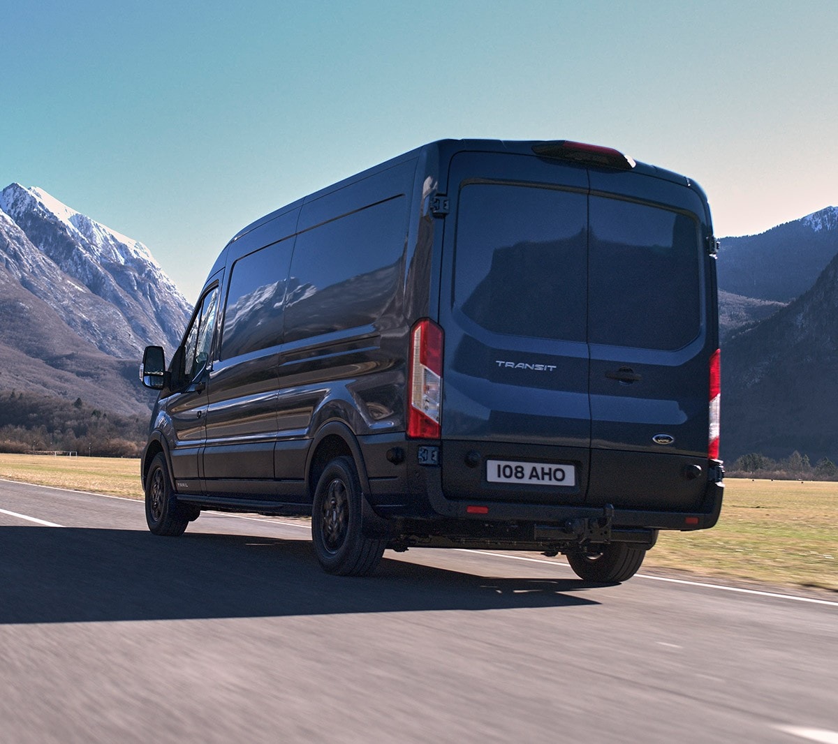 new Ford Transit Van Trail driving on mountain road